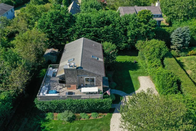 an aerial view of a house with a garden