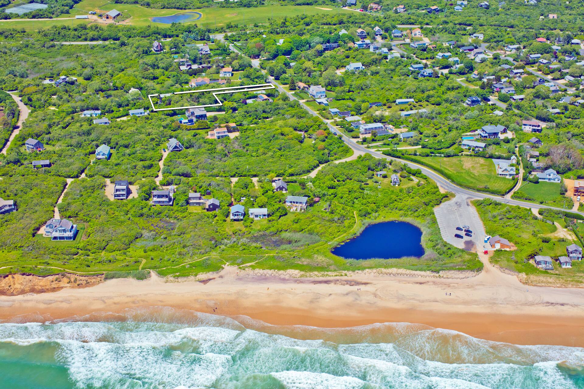 28 Ditch Plains Road Montauk, NY 11954 - Photo 30 of 30 a small garden covered with tall trees