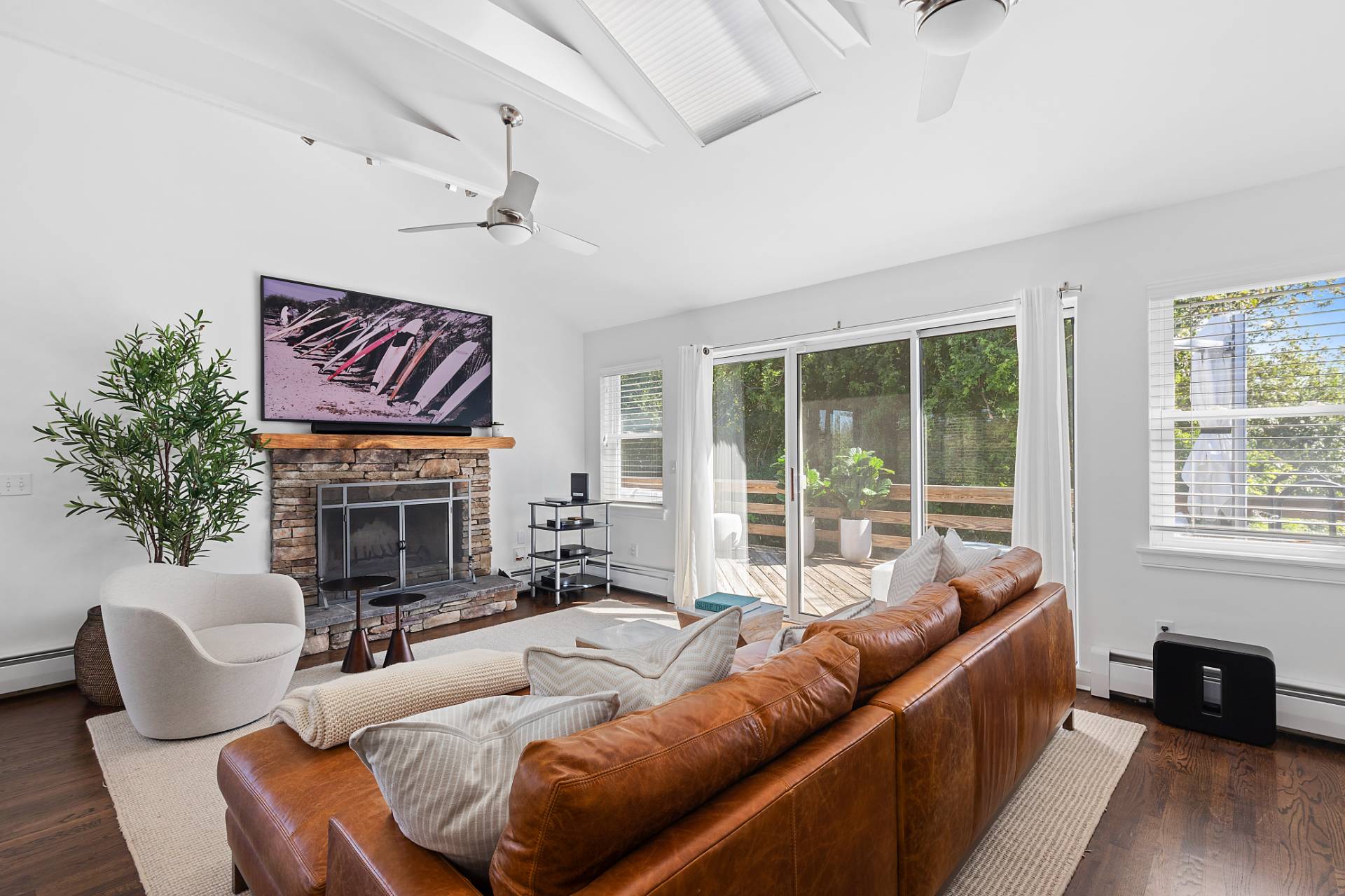28 Ditch Plains Road Montauk, NY 11954 - Photo 5 of 30 a living room with furniture and a fireplace