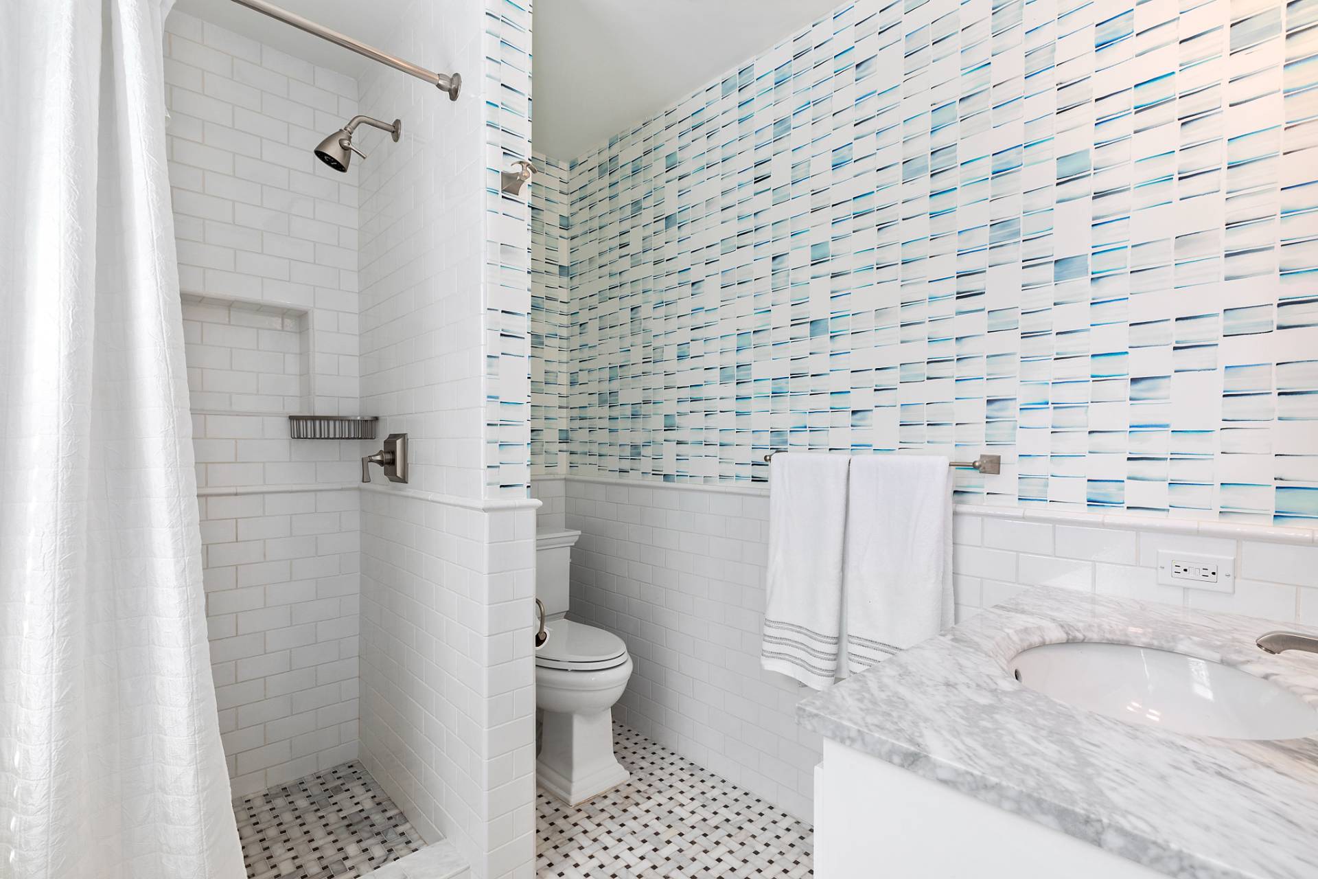 28 Ditch Plains Road Montauk, NY 11954 - Photo 9 of 30 a bathroom with a granite countertop bathtub and toilet