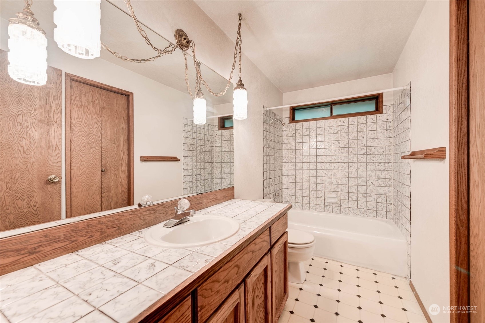 20821 30th Drive Southeast Bothell, WA 98021 - Photo 12 of 27 a bathroom with a sink a toilet a mirror and shower
