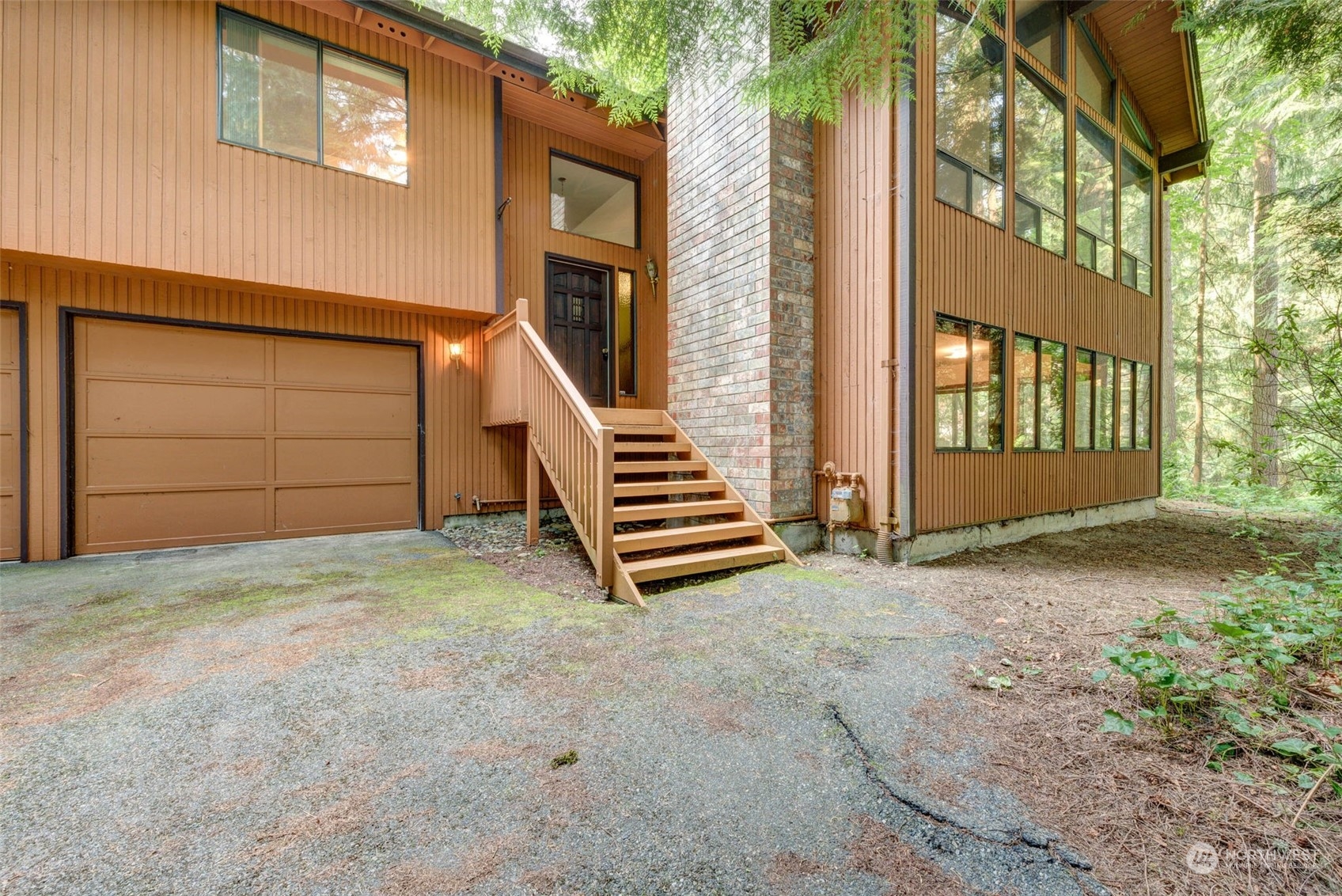 20821 30th Drive Southeast Bothell, WA 98021 - Photo 2 of 27 a view of a house with a yard and garage
