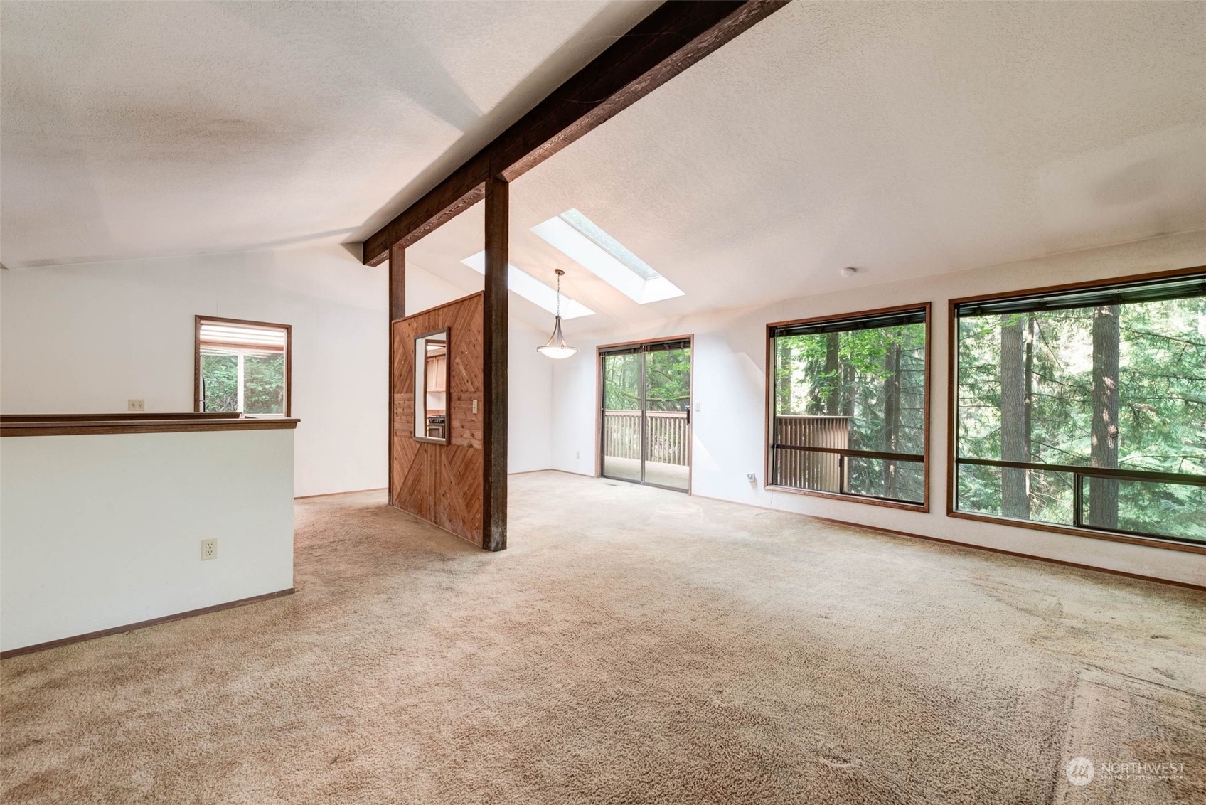 20821 30th Drive Southeast Bothell, WA 98021 - Photo 3 of 27 a view of an empty room with large windows