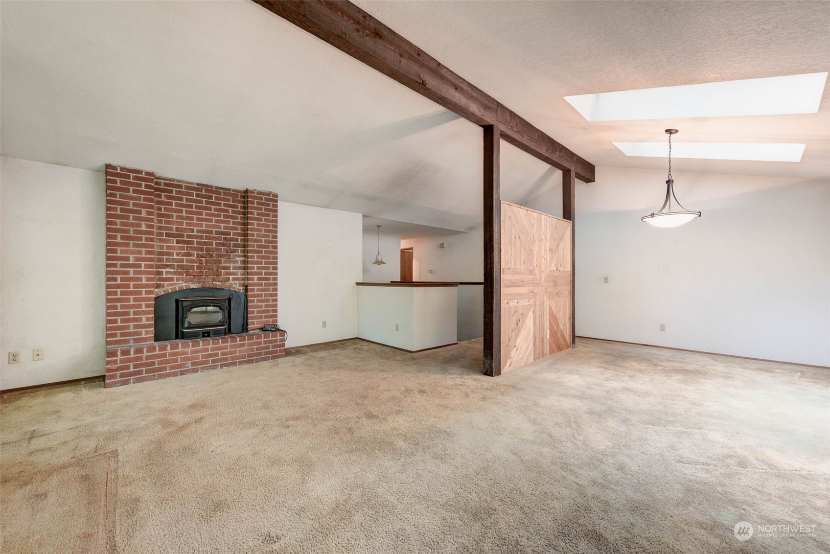 20821 30th Drive Southeast Bothell, WA 98021 - Photo 5 of 27 a view of an empty room with a fireplace and a window