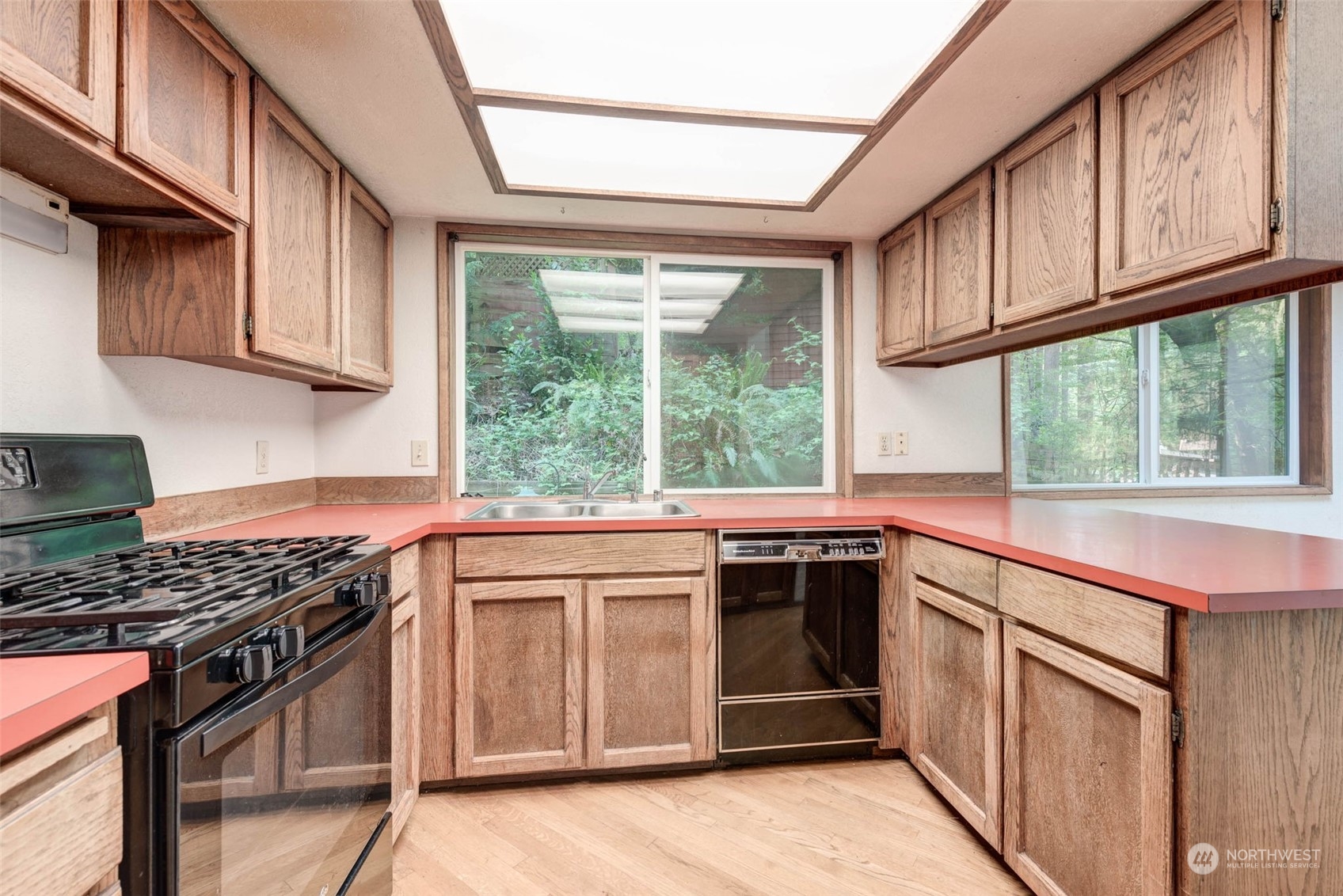 20821 30th Drive Southeast Bothell, WA 98021 - Photo 8 of 27 a kitchen with stainless steel appliances granite countertop a stove a sink and a microwave