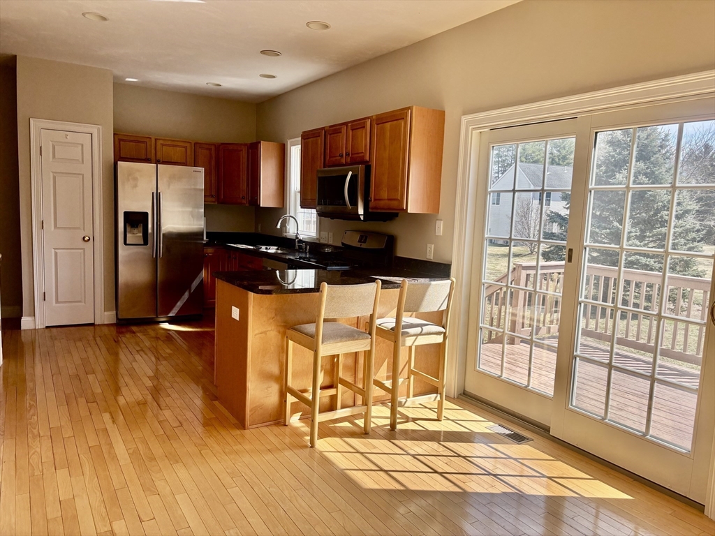 36 Knowlton Circle, Unit 1 Upton, MA 01568 - Photo 11 of 37 a very nice looking room with wooden floor and furniture