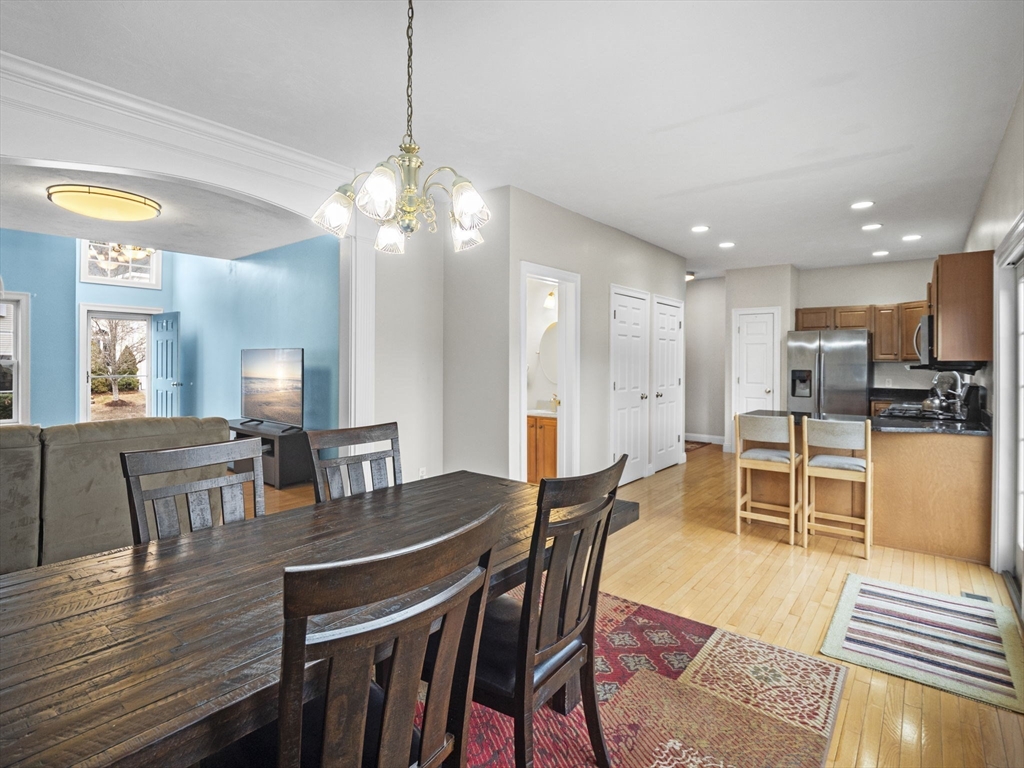 36 Knowlton Circle, Unit 1 Upton, MA 01568 - Photo 14 of 37 a view of a dining room with furniture and wooden floor