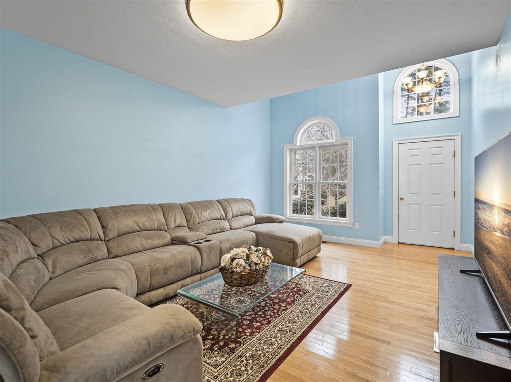 36 Knowlton Circle, Unit 1 Upton, MA 01568 - Photo 17 of 37 a living room with furniture and a couch