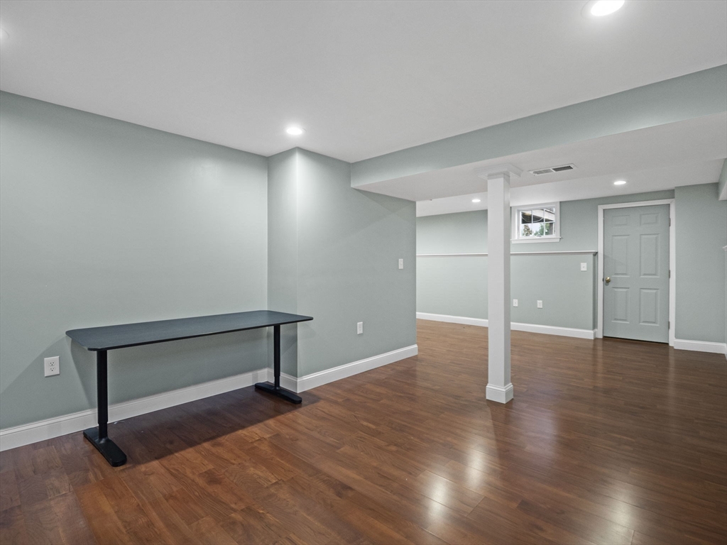 36 Knowlton Circle, Unit 1 Upton, MA 01568 - Photo 21 of 37 a view of an empty room with wooden floor