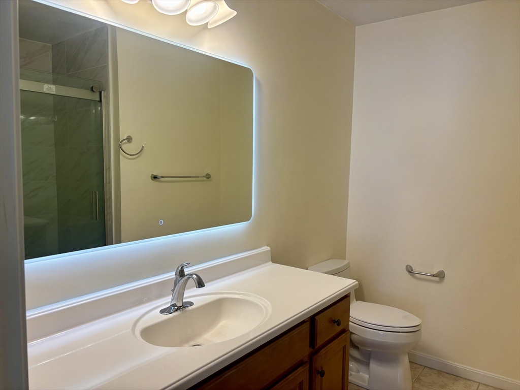 36 Knowlton Circle, Unit 1 Upton, MA 01568 - Photo 23 of 37 a bathroom with a sink and a toilet