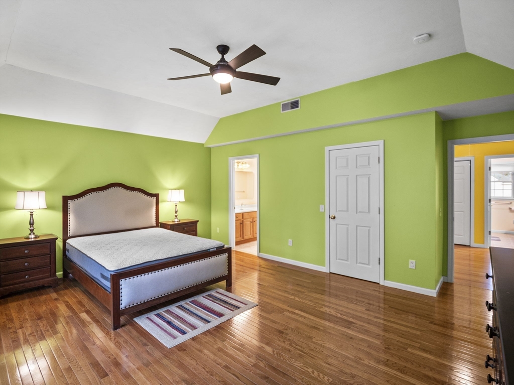 36 Knowlton Circle, Unit 1 Upton, MA 01568 - Photo 25 of 37 a spacious bedroom with a bed and wooden floor