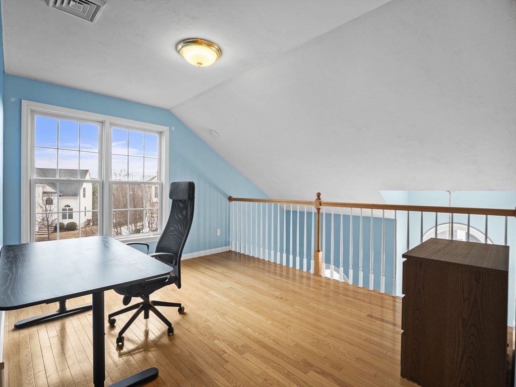 36 Knowlton Circle, Unit 1 Upton, MA 01568 - Photo 31 of 37 a workspace with furniture window and wooden floor