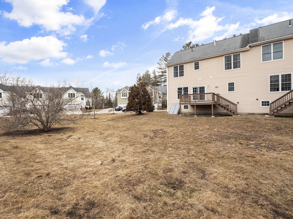 36 Knowlton Circle, Unit 1 Upton, MA 01568 - Photo 36 of 37 a view of a house with a patio