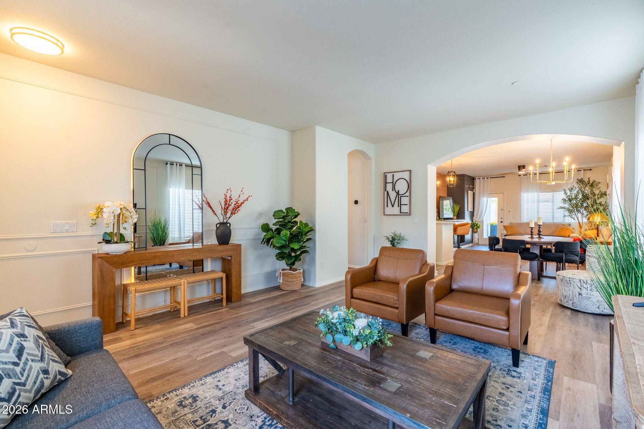 3674 South Joshua Tree Lane Gilbert, AZ 85297 - Photo 8 of 30 a living room with furniture and wooden floor