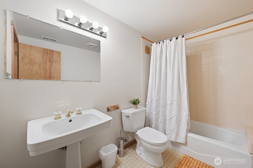 18013 West Snoqualmie Valley Road Northeast Duvall, WA 98019 - Photo 14 of 40 a bathroom with a sink toilet and shower