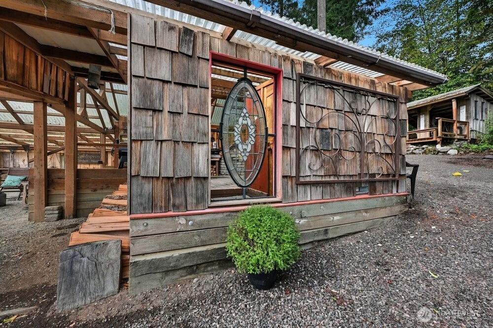 18013 West Snoqualmie Valley Road Northeast Duvall, WA 98019 - Photo 19 of 40 a backyard of a house with wooden fence and large trees