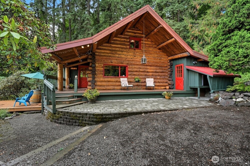 18013 West Snoqualmie Valley Road Northeast Duvall, WA 98019 - Photo 20 of 40 a front view of a house with a yard