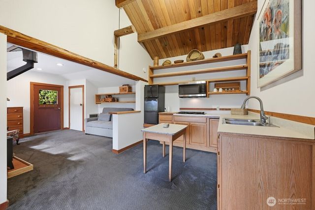 a white toilet sitting next to a shower