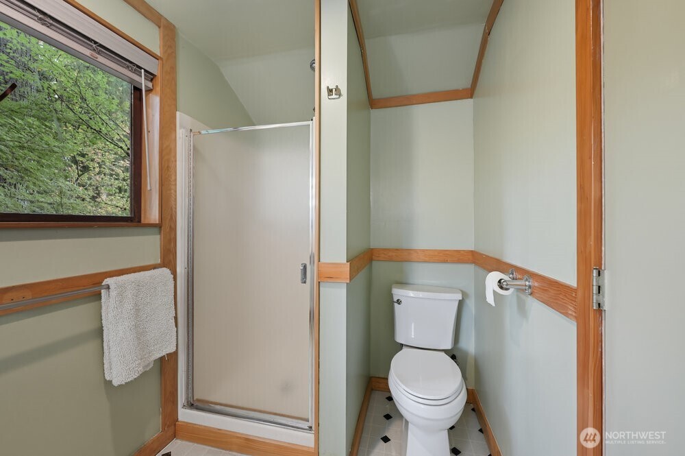 18013 West Snoqualmie Valley Road Northeast Duvall, WA 98019 - Photo 29 of 40 a white toilet sitting next to a shower