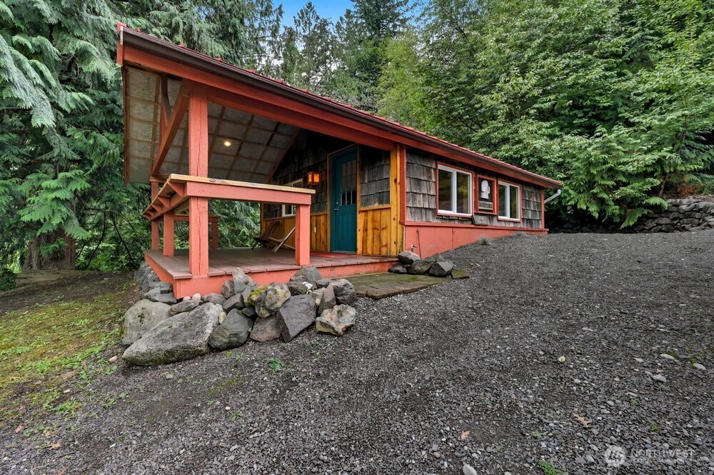 18013 West Snoqualmie Valley Road Northeast Duvall, WA 98019 - Photo 30 of 40 a backyard of a house with table and chairs