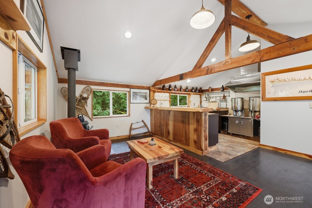 18013 West Snoqualmie Valley Road Northeast Duvall, WA 98019 - Photo 31 of 40 a living room with furniture a air conditioner vent and a window