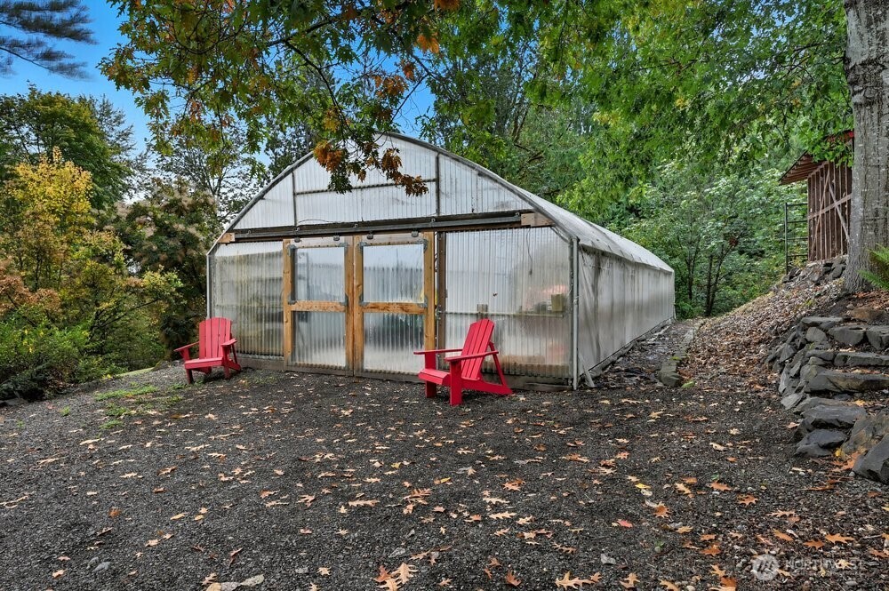18013 West Snoqualmie Valley Road Northeast Duvall, WA 98019 - Photo 33 of 40 a backyard of a house with portable swimming pool and outdoor seating