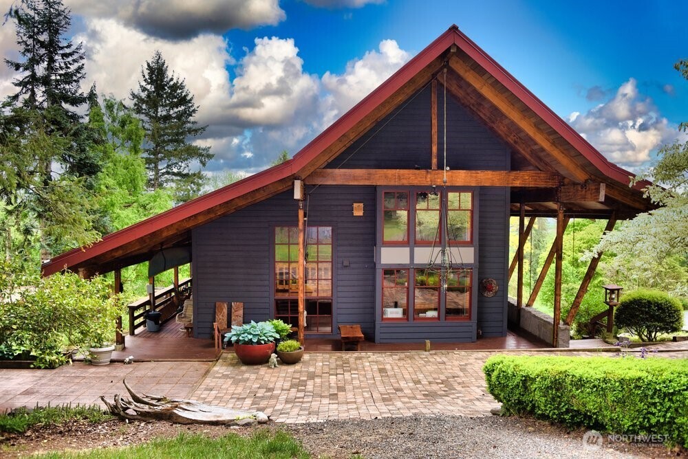 18013 West Snoqualmie Valley Road Northeast Duvall, WA 98019 - Photo 5 of 40 a front view of a house with garden