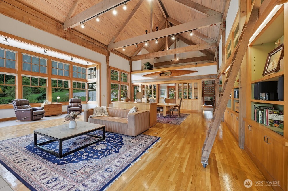 18013 West Snoqualmie Valley Road Northeast Duvall, WA 98019 - Photo 6 of 40 a living room with furniture fireplace and a table