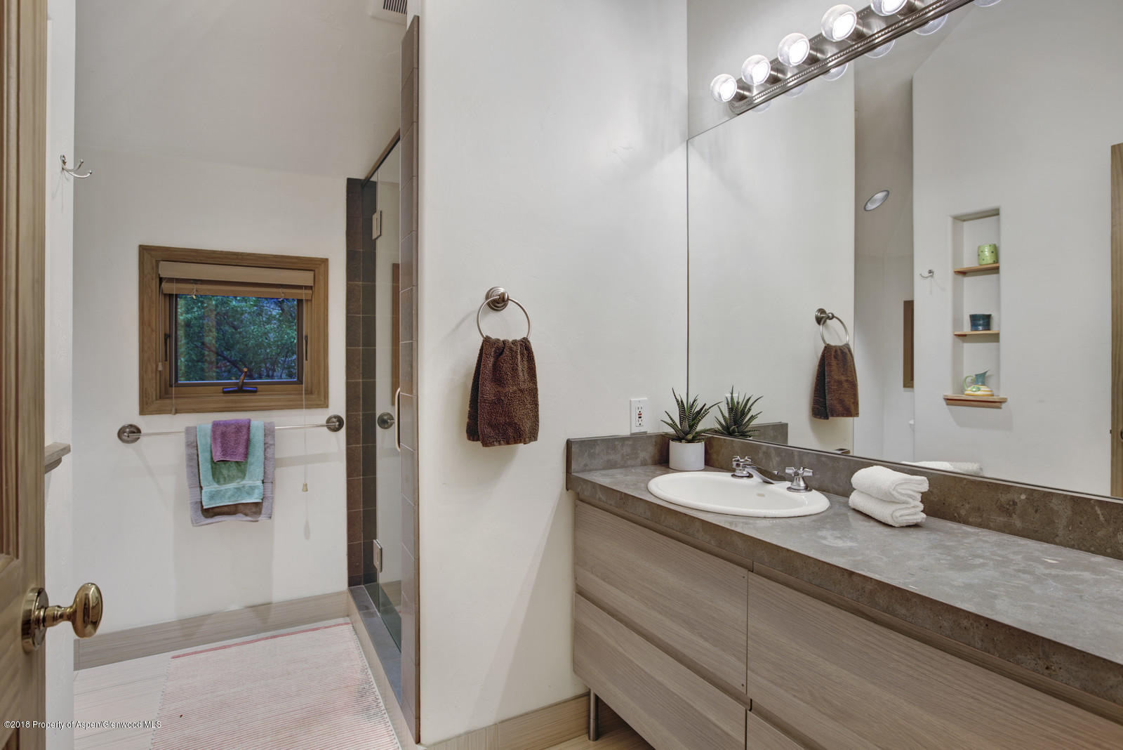 146 East Homestead Drive Basalt, CO 81621 - Photo 23 of 42 a bathroom with a sink and a mirror