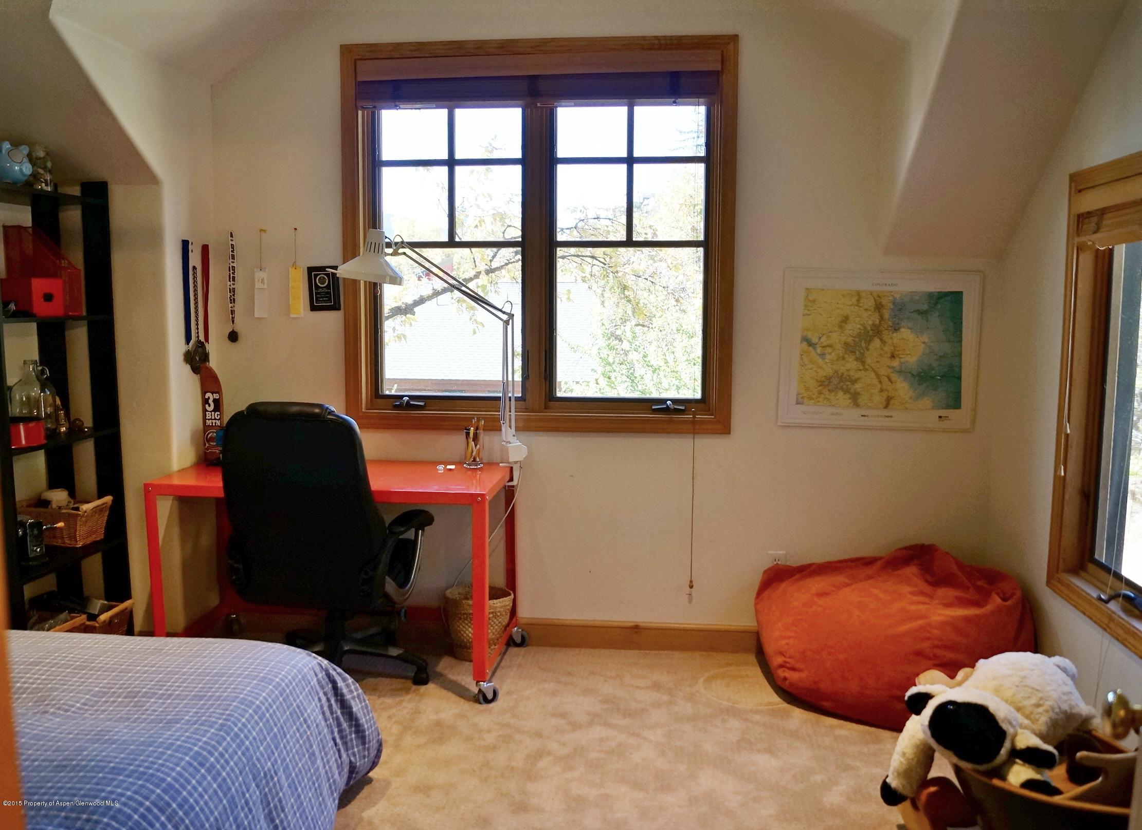 146 East Homestead Drive Basalt, CO 81621 - Photo 25 of 42 a bedroom with a bed and a window