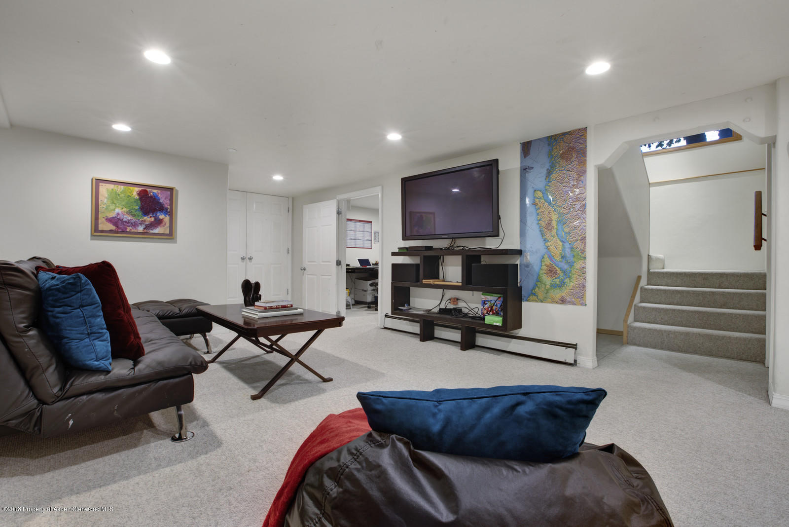 146 East Homestead Drive Basalt, CO 81621 - Photo 28 of 42 a living room with furniture and a flat screen tv
