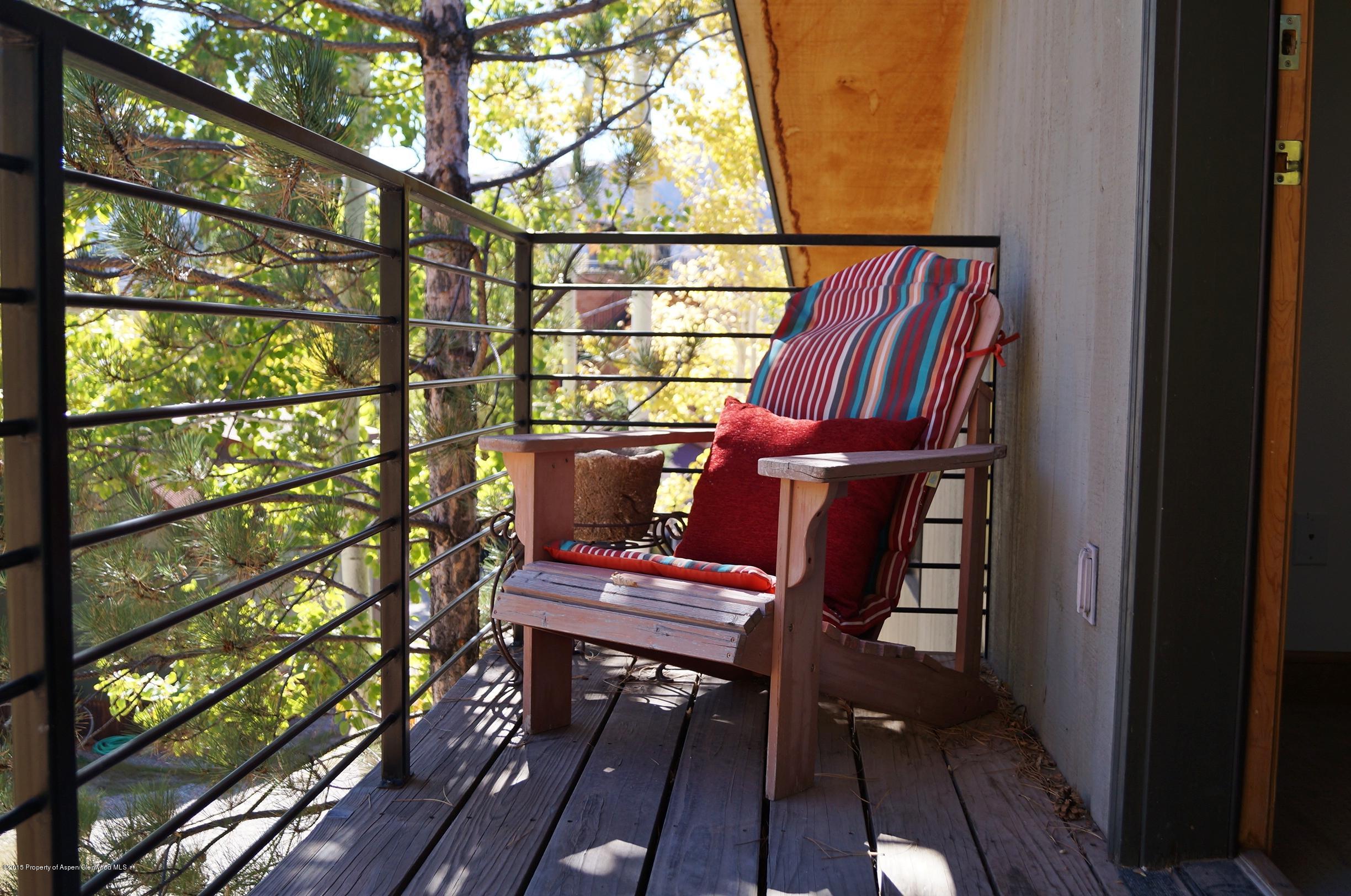 146 East Homestead Drive Basalt, CO 81621 - Photo 30 of 42 a view of a balcony with wooden floor and outdoor seating