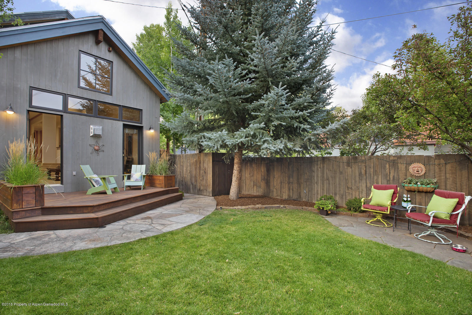 146 East Homestead Drive Basalt, CO 81621 - Photo 39 of 42 a view of a backyard with a sitting area and slide