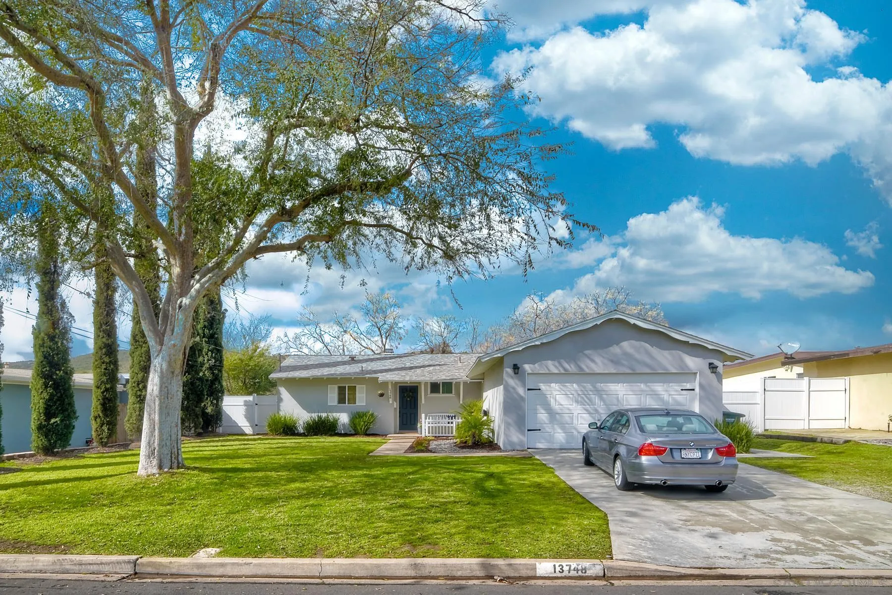 13748 Tobiasson Road Poway, CA 92064 - Photo 1 of 18 a car parked in front of a house