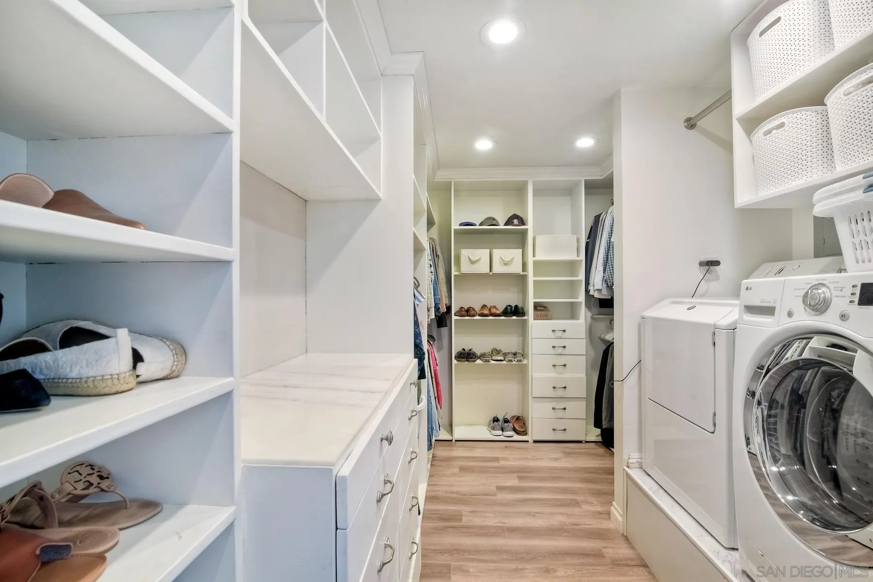 13748 Tobiasson Road Poway, CA 92064 - Photo 11 of 18 a view of walk in closet with clothes and shoes