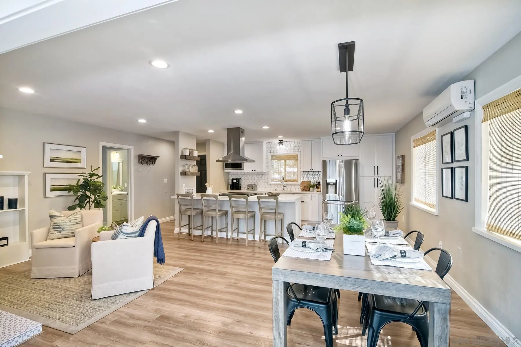13748 Tobiasson Road Poway, CA 92064 - Photo 3 of 18 a view of a dining room with furniture wooden floor and a chandelier