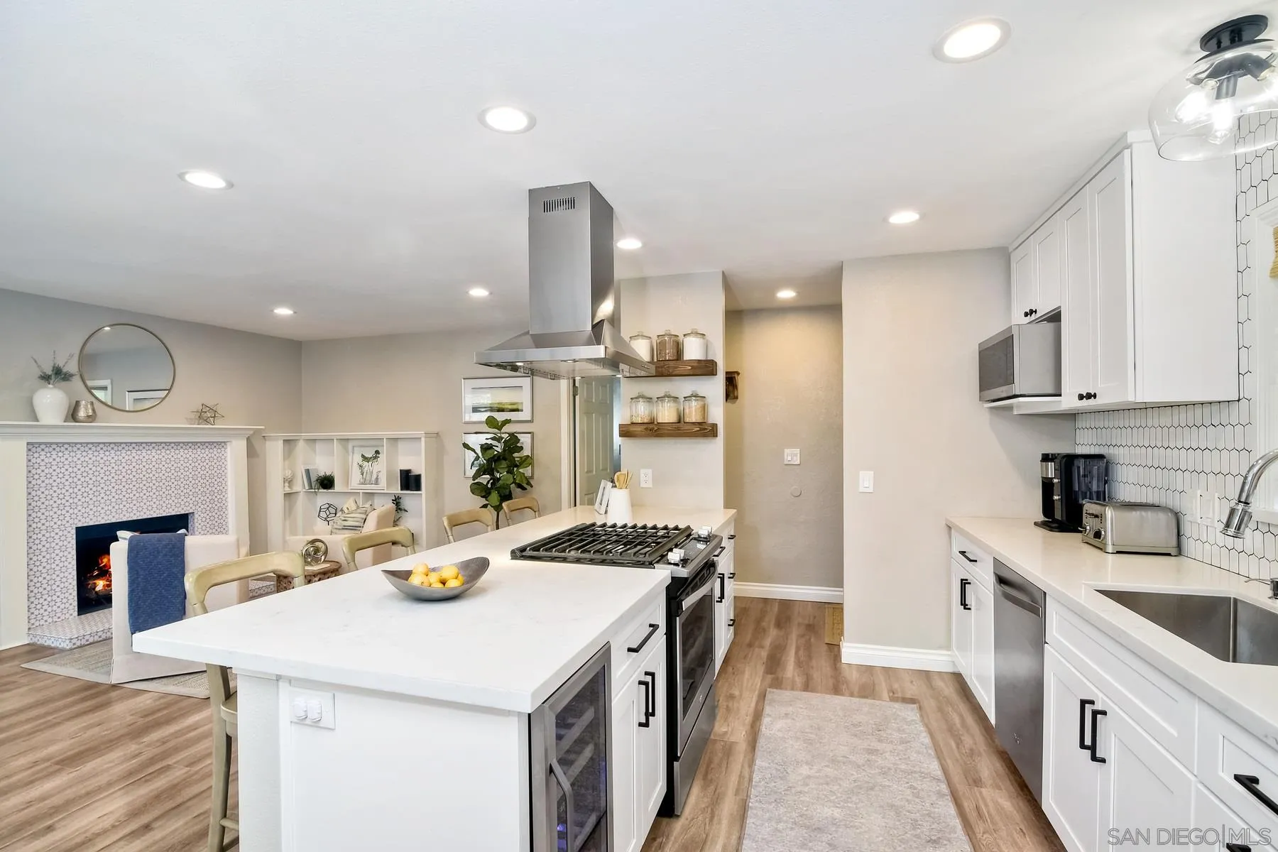 13748 Tobiasson Road Poway, CA 92064 - Photo 5 of 18 a kitchen with stainless steel appliances kitchen island granite countertop a sink stove and refrigerator