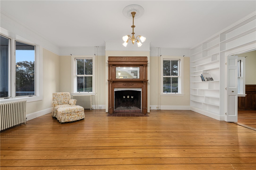 39 Walcott Avenue Jamestown, RI 02835 - Photo 11 of 46 The living room with built in bookcases is 14'8" x 19'9".