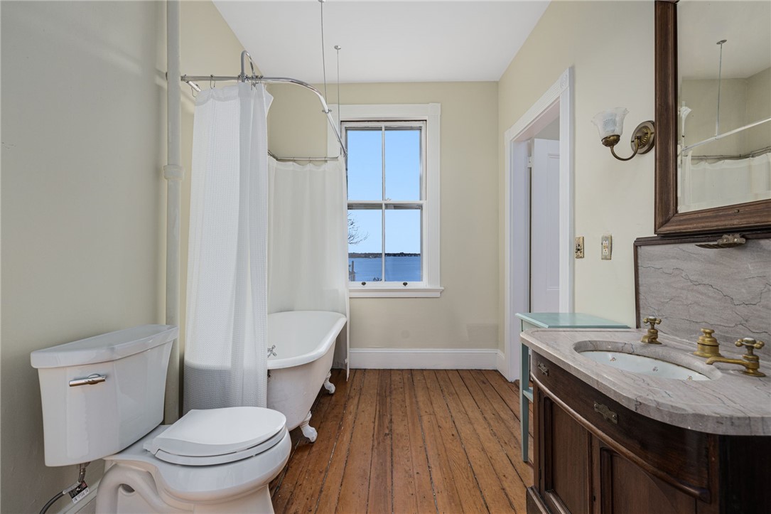 39 Walcott Avenue Jamestown, RI 02835 - Photo 27 of 46 Full bath with wonderful claw foot tub and marble sink.