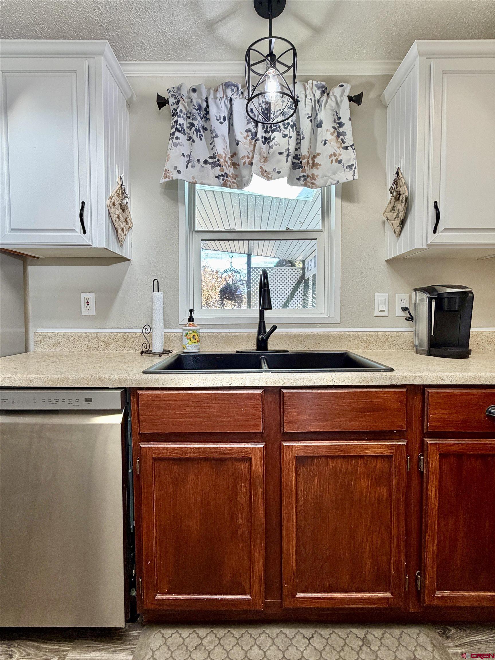 650 1725th Road Delta, CO 81416 - Photo 14 of 45 a kitchen with a sink and cabinets