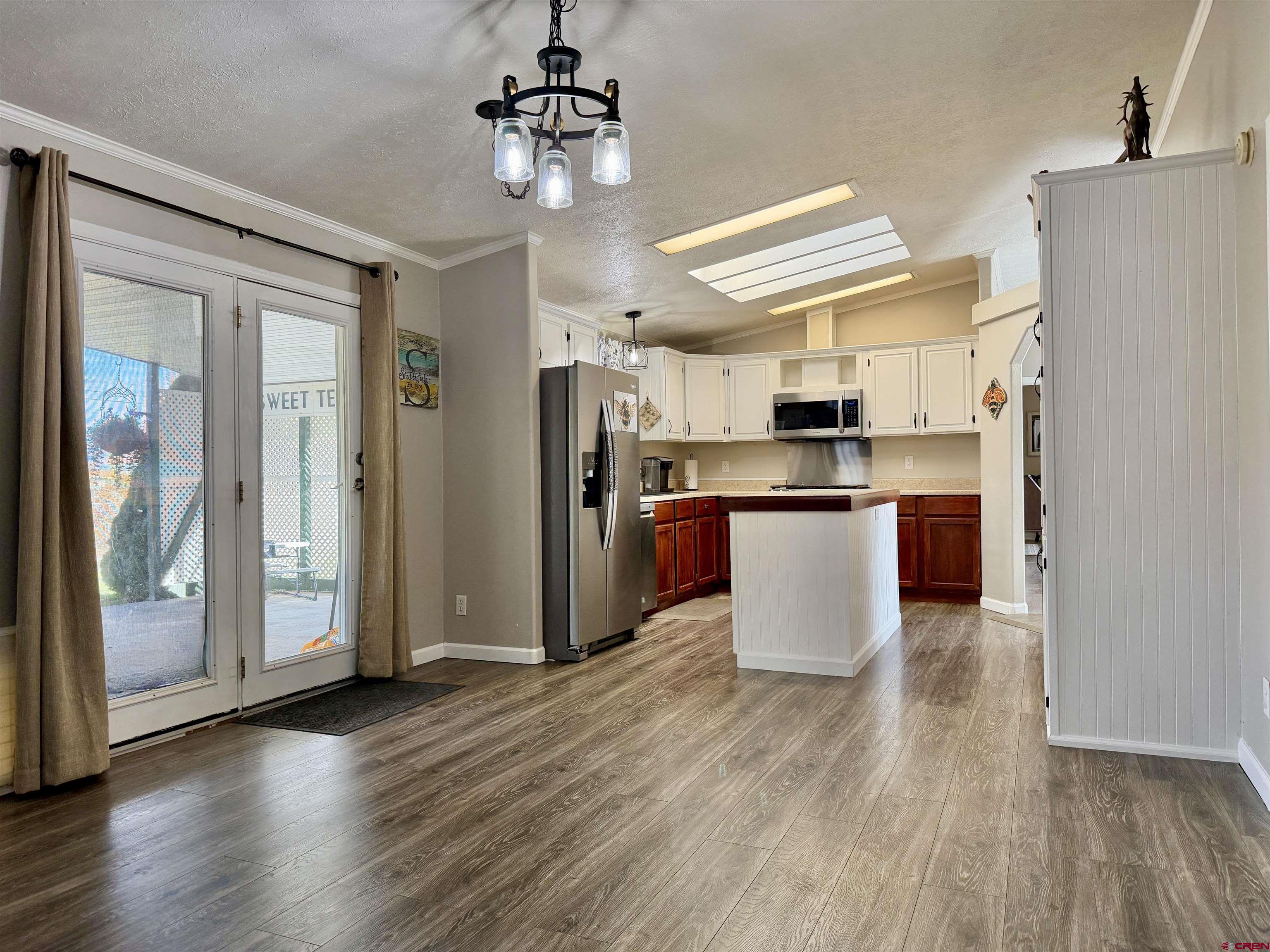 650 1725th Road Delta, CO 81416 - Photo 15 of 45 a kitchen with stainless steel appliances granite countertop a refrigerator and a stove top oven