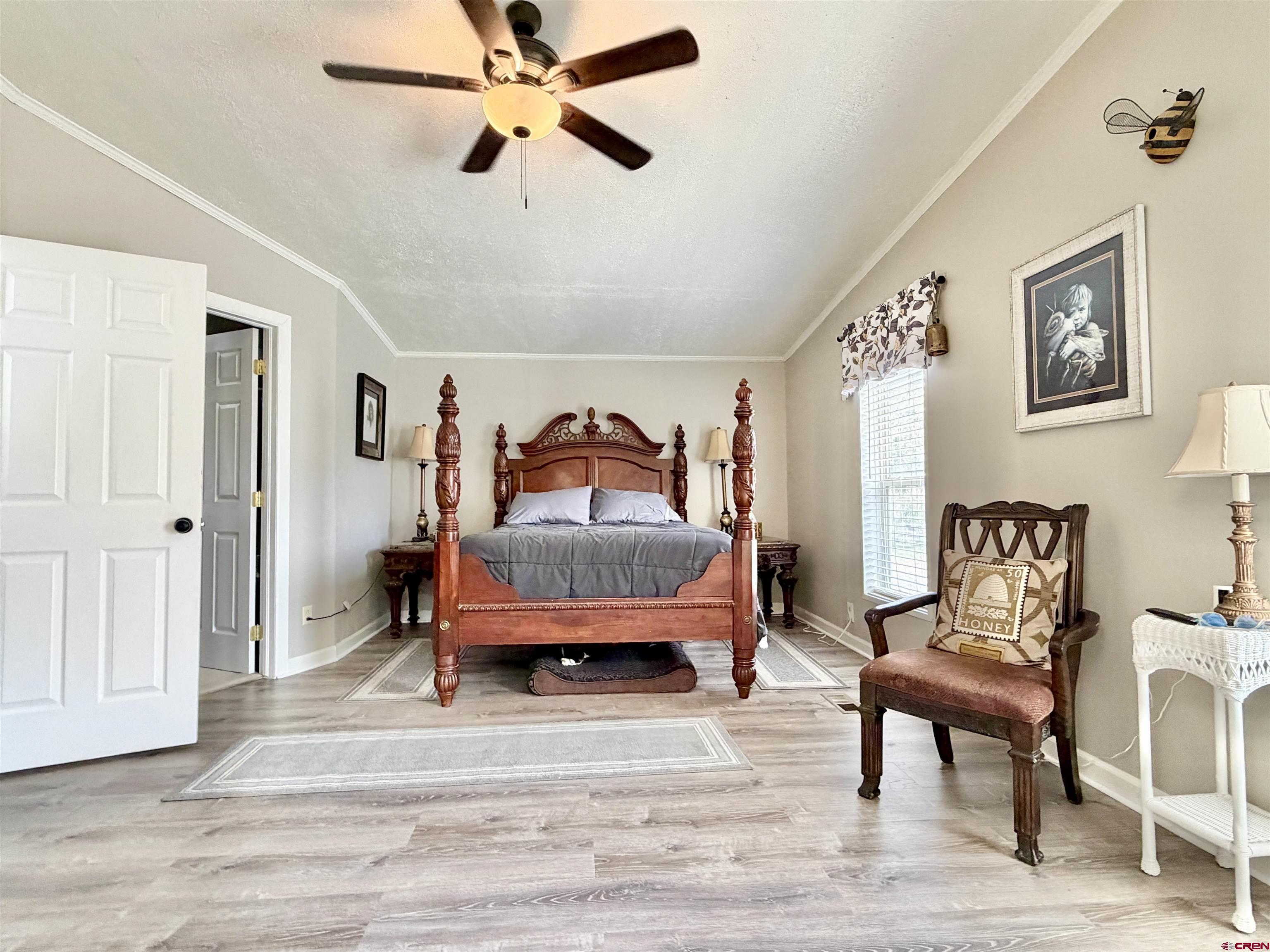 650 1725th Road Delta, CO 81416 - Photo 20 of 45 a bedroom with a bed and a chair