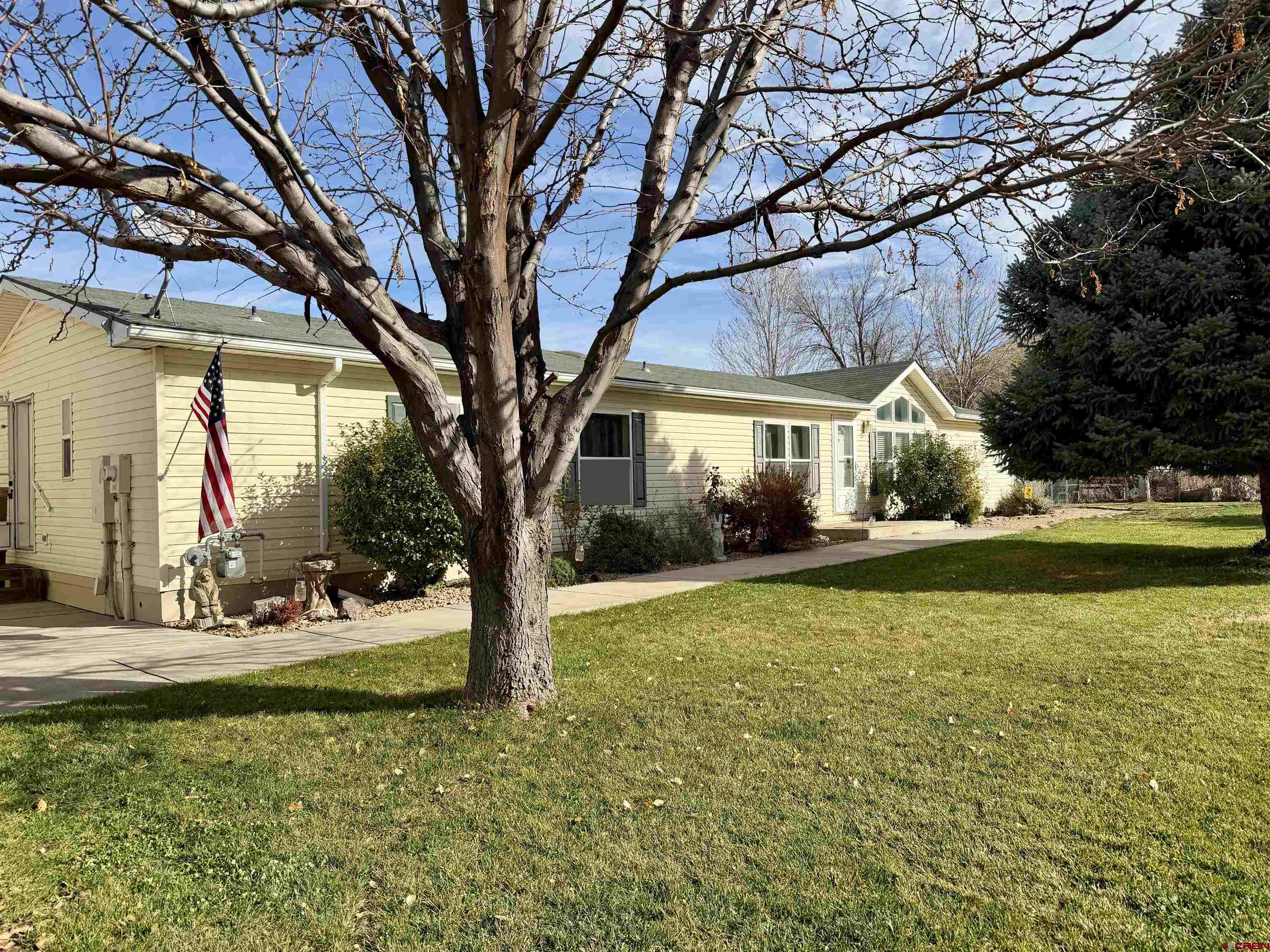 650 1725th Road Delta, CO 81416 - Photo 2 of 45 a view of swimming pool with a table and chairs under an umbrella