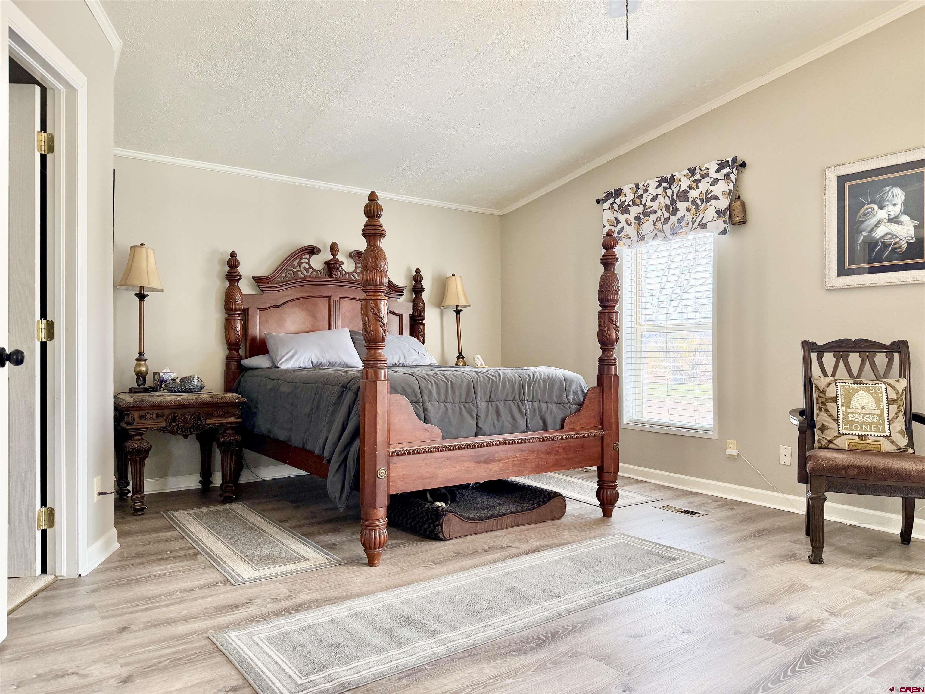650 1725th Road Delta, CO 81416 - Photo 21 of 45 a bedroom with furniture and a rug