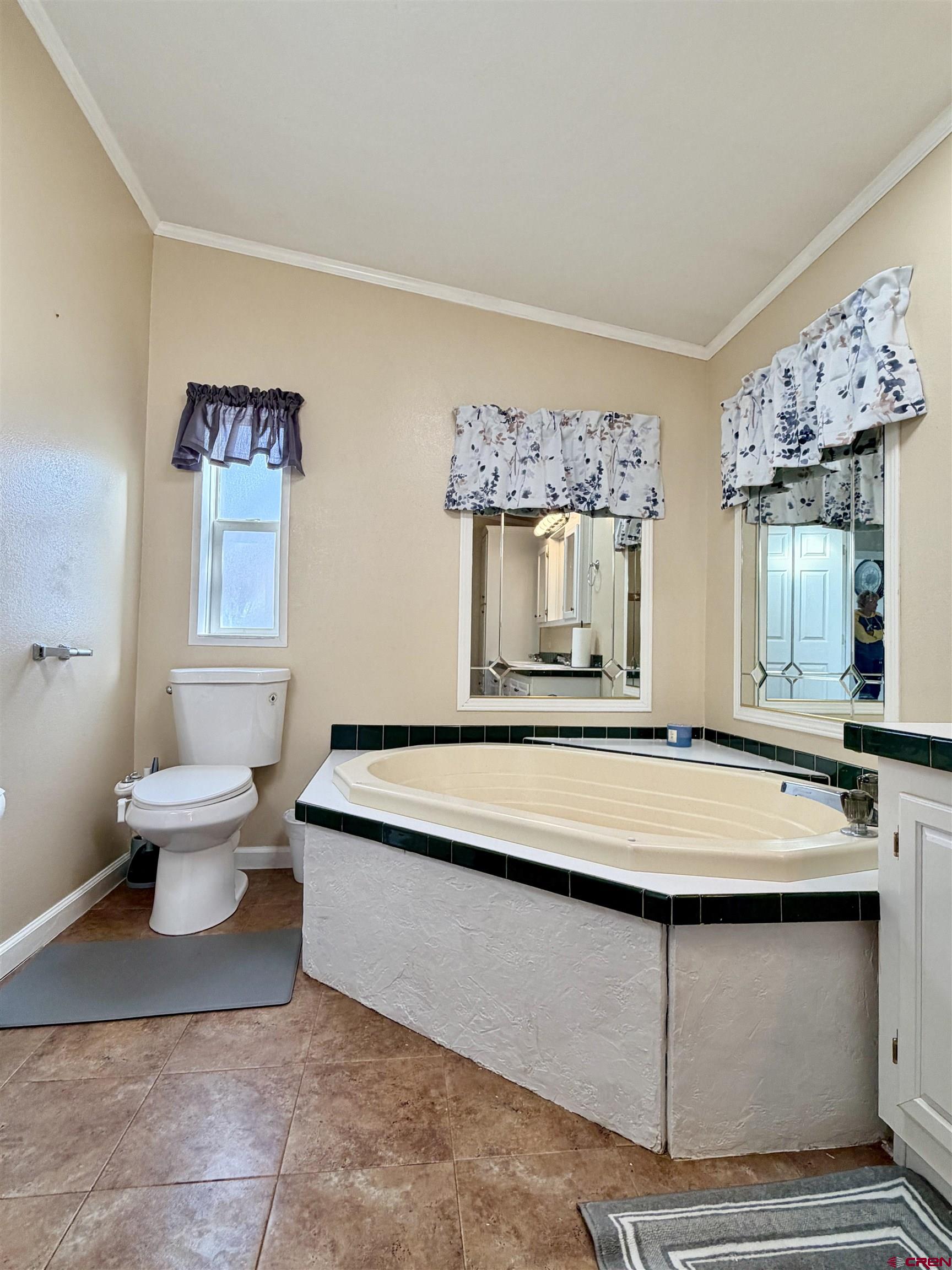 650 1725th Road Delta, CO 81416 - Photo 24 of 45 a room with table chairs and a large window