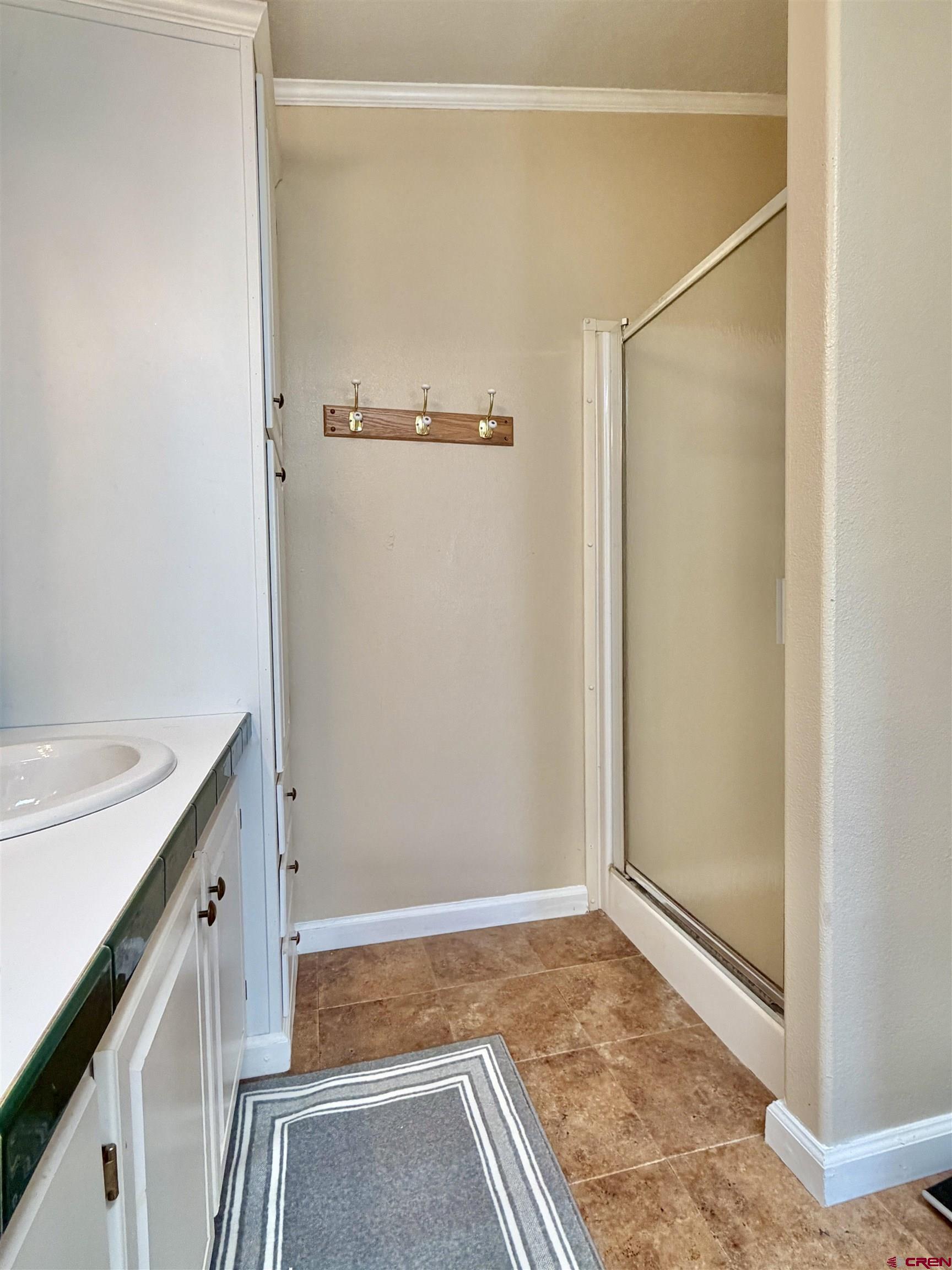 650 1725th Road Delta, CO 81416 - Photo 25 of 45 a bathroom with a sink and a mirror