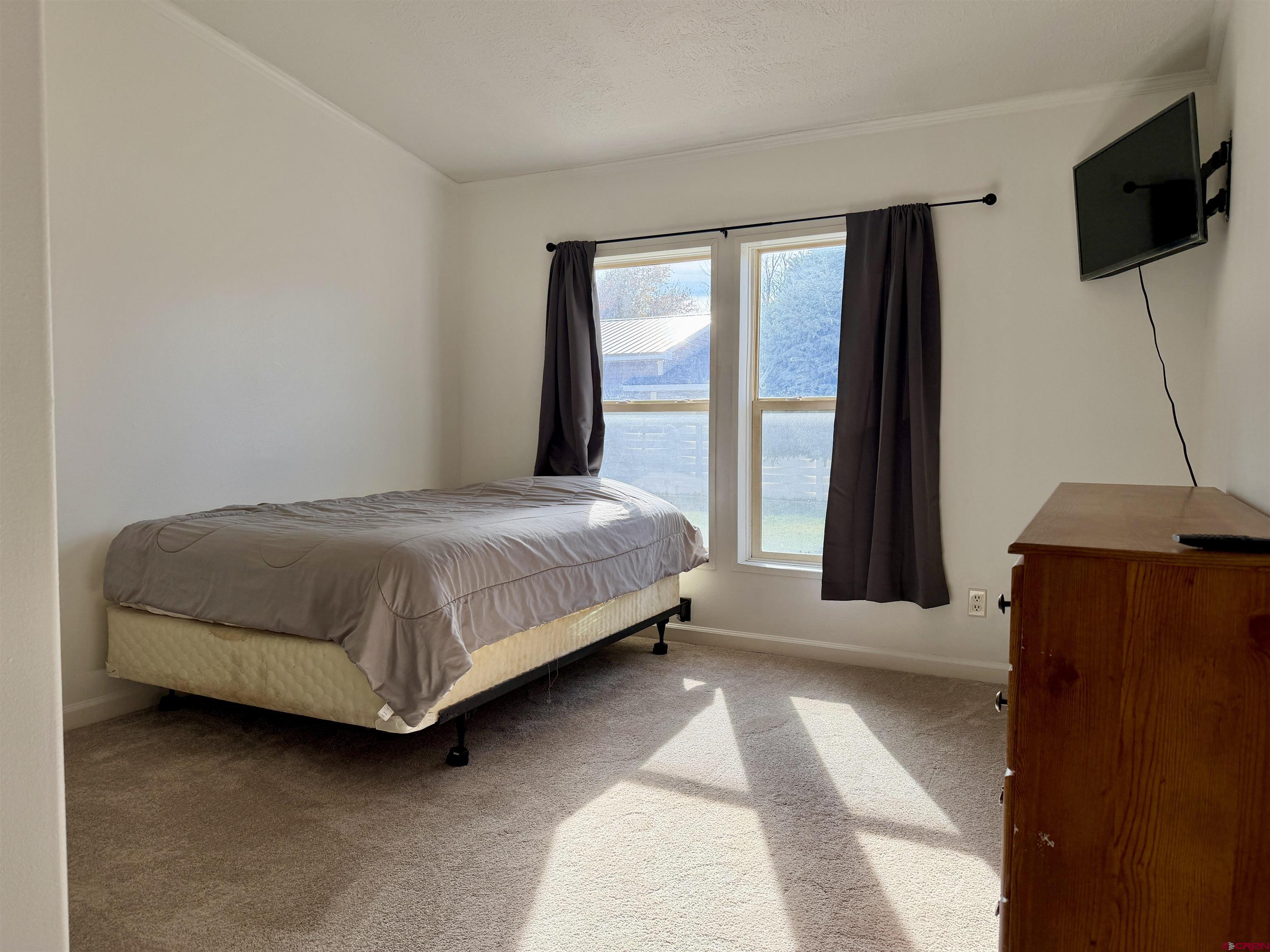 650 1725th Road Delta, CO 81416 - Photo 26 of 45 a bedroom with a bed and large window