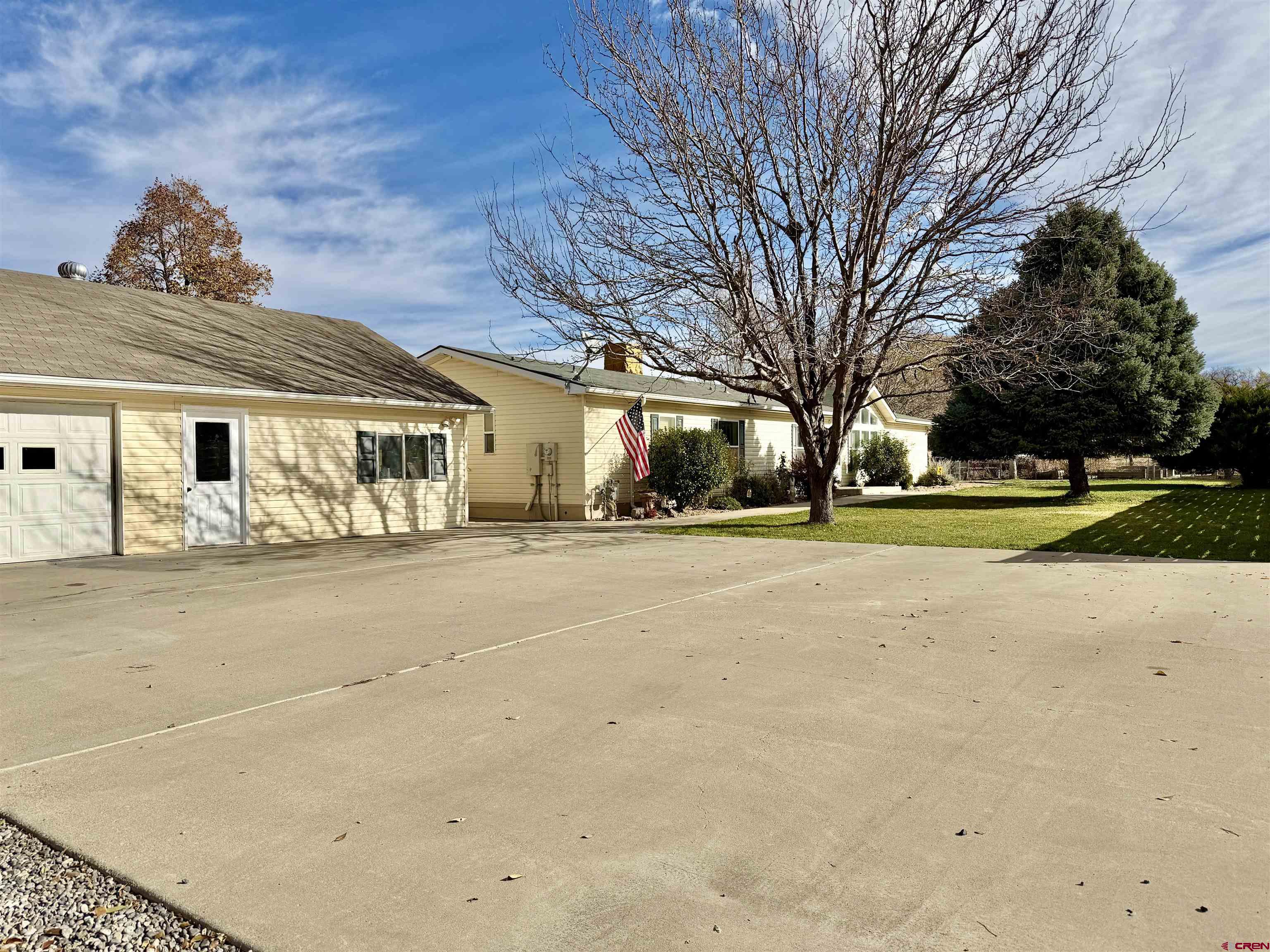 650 1725th Road Delta, CO 81416 - Photo 3 of 45 a front view of a building with large trees