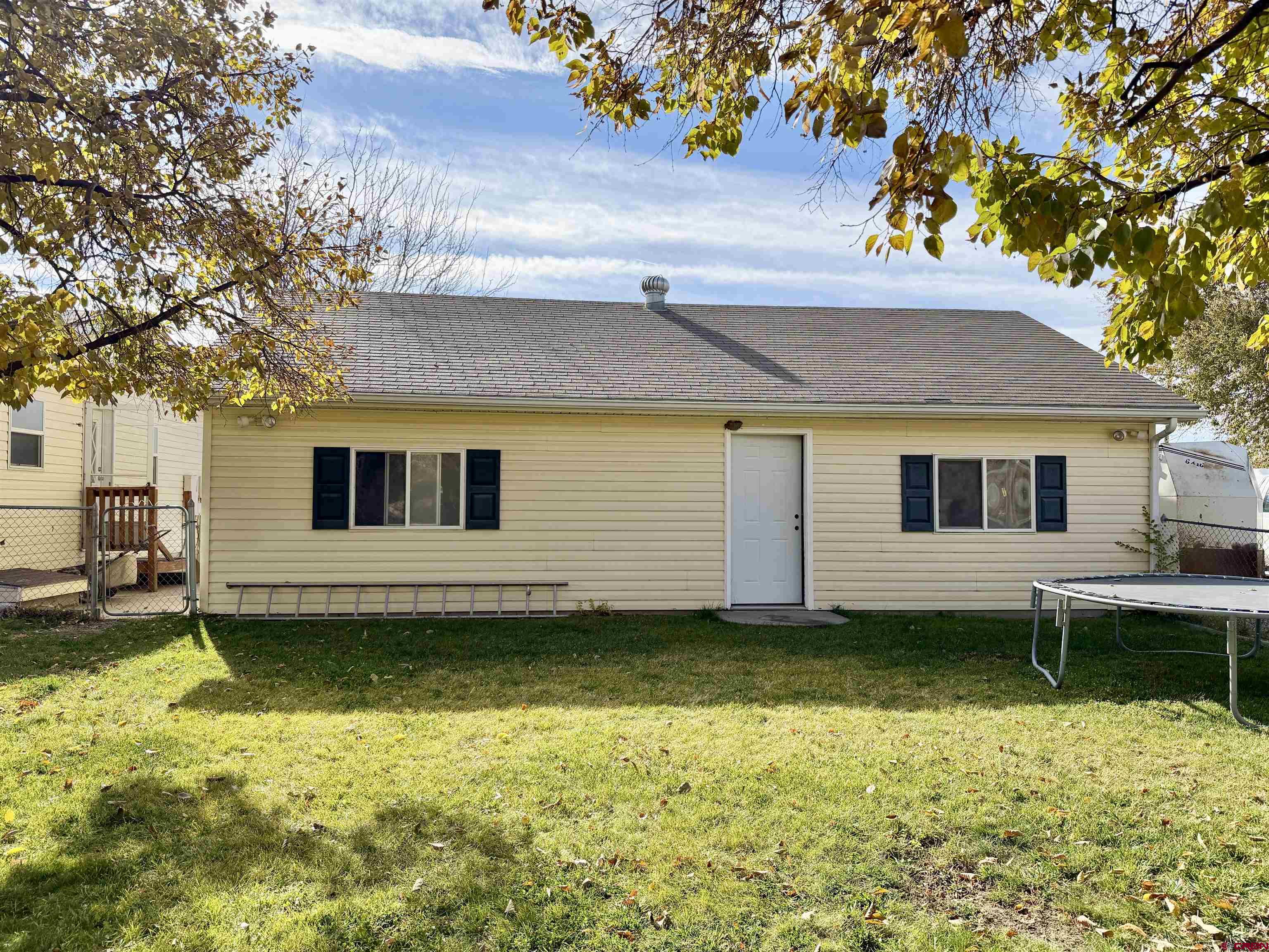 650 1725th Road Delta, CO 81416 - Photo 33 of 45 a view of a house with a yard