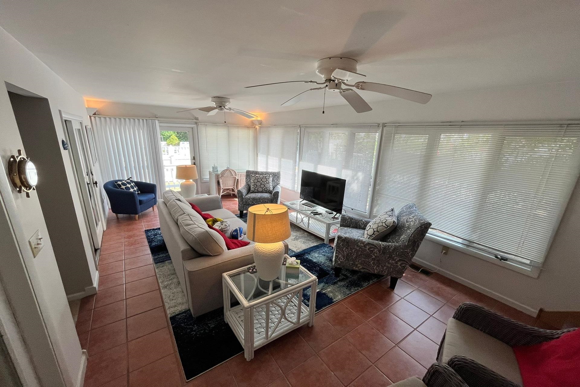 76 21st Street Avalon, NJ 08202 - Photo 11 of 18 a living room with furniture and a flat screen tv